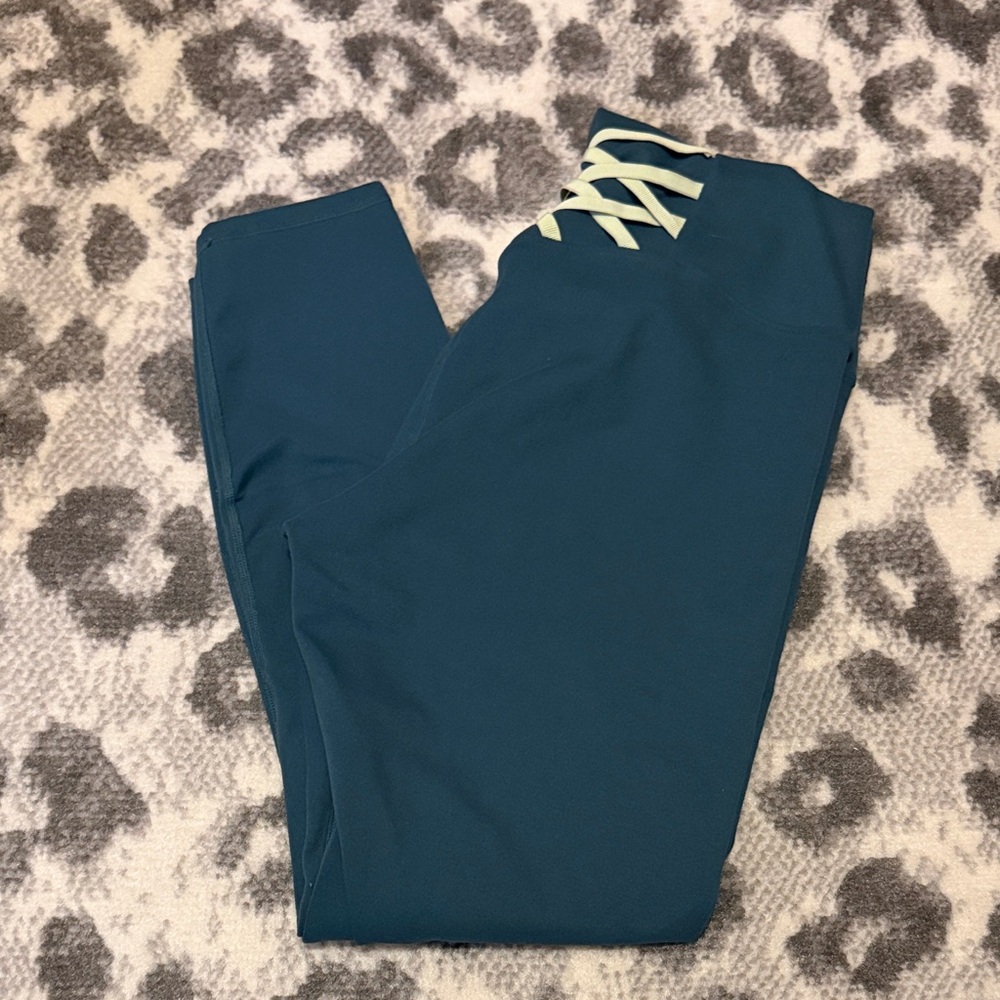 Fabletics green Leggings with criss cross back design